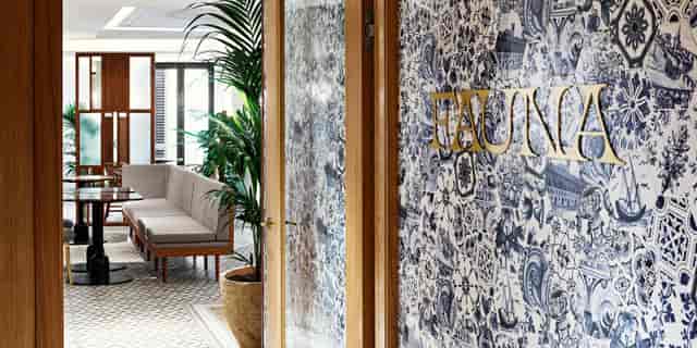 Fauna restaurant boutique breakout space with brass signage for corporate events and board meetings.