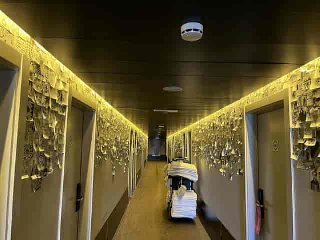 Housekeeping carts cluttering a hotel corridor, poor guest experience, event logistics, hotel audit.