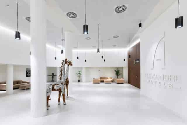 Modern hotel lobby at Alexandre Fira Congress for delegate registration and corporate networking.