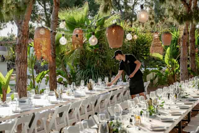 Open-air gala dining at Gran Villa Rosa with string lighting for corporate retreats.