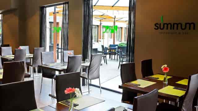 Modern hotel restaurant for professional corporate events and networking breakout sessions.