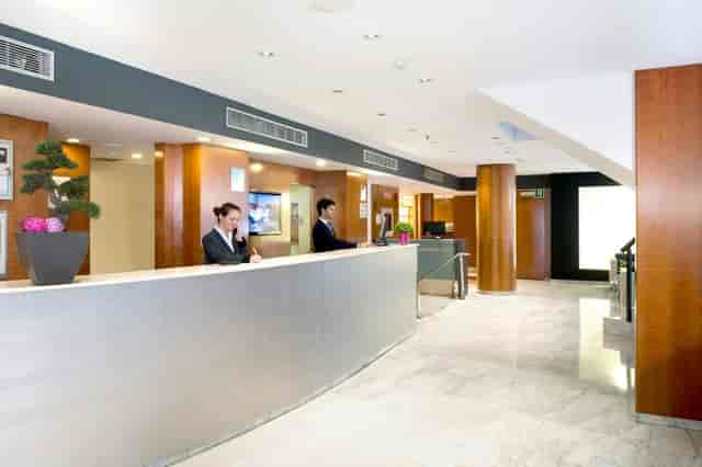 Modern Montserrat hotel reception for event registration and corporate check-in.
