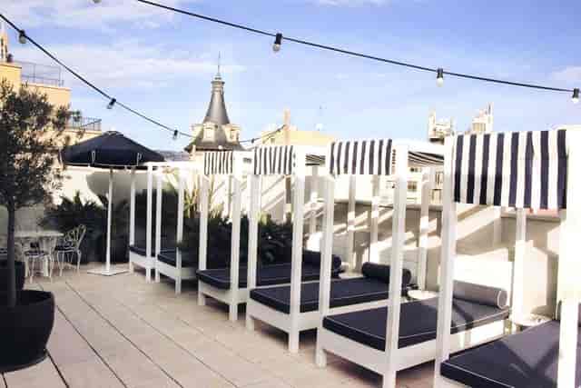 Rooftop lounge with cabana seating at Hotel Midmost, ideal for networking events and retreats.