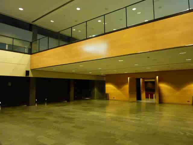 Esade Forum Amphitheater Foyer, industrial event space for corporate networking and registration.