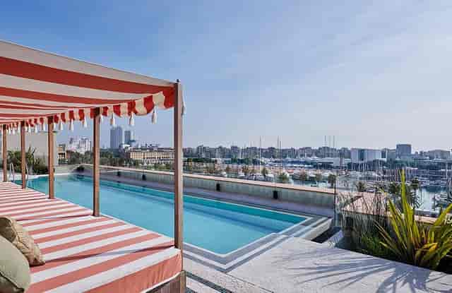 Soho House Barcelona rooftop terrace with waterfront views for upscale corporate event hosting.