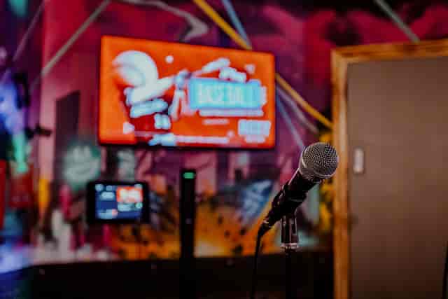 Karaoke room at Roxy Lanes, Cardiff with microphone for energetic entertainment events.