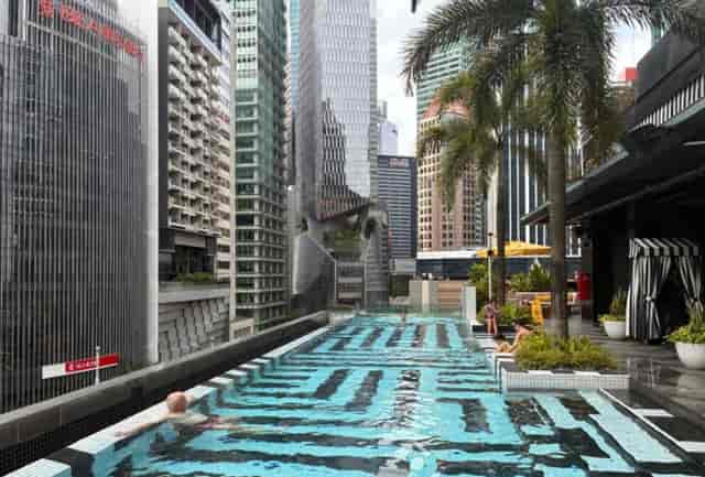 Rooftop pool at QT Singapore for upscale events and corporate retreats.
