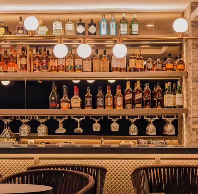 Cooling Tower Rooftop Bar in Singapore featuring premium spirits for corporate networking events.