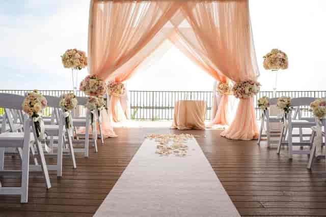 Palais Royale courtyard outdoor wedding ceremony with floral altar and seating for events.