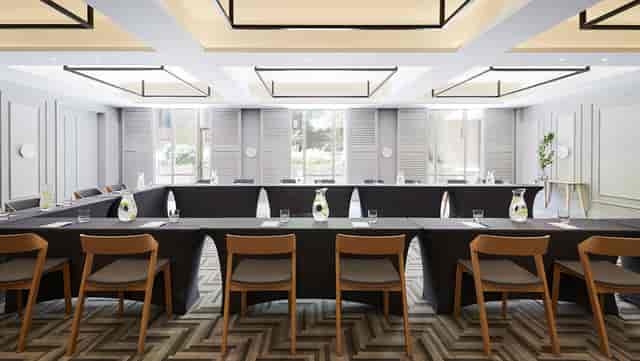 Peregrine Room boardroom with U-shape seating, ideal for professional meetings and events.