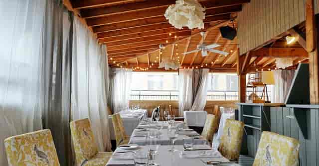 The Fifth Social Club: Intimate venue with string lighting for corporate events and social dinners.