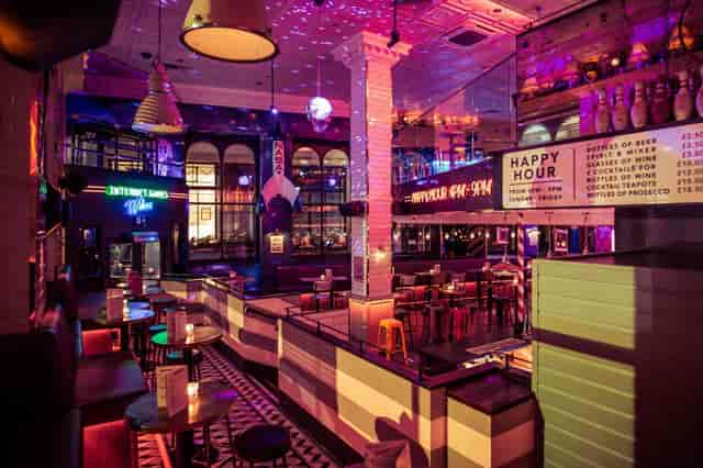 Neon-lit Simmons Bar venue for team-building events and corporate mixers.