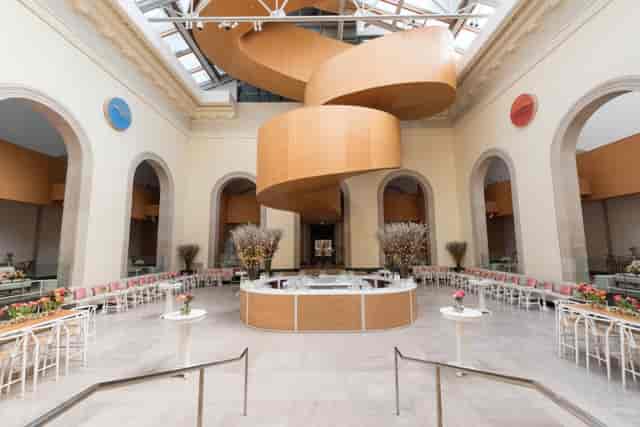 Walker Court atrium with grand staircase, set for formal reception and corporate event venue.