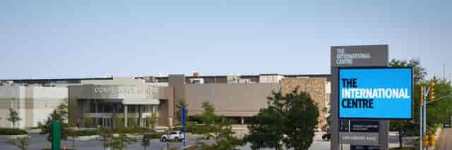 International Centre venue exterior with parking, ideal for trade shows and corporate conventions.