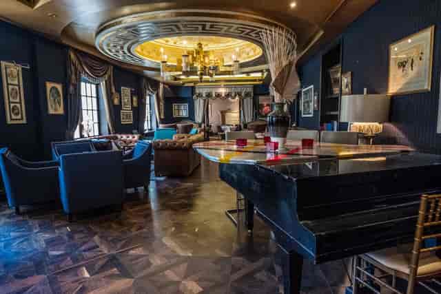 Gatsby Restaurant VIP lounge with grand piano for exclusive networking and sophisticated events.