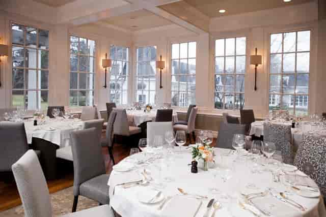 Firshade Room round-table setup for upscale wedding reception or corporate banquet at Langdon Hall.