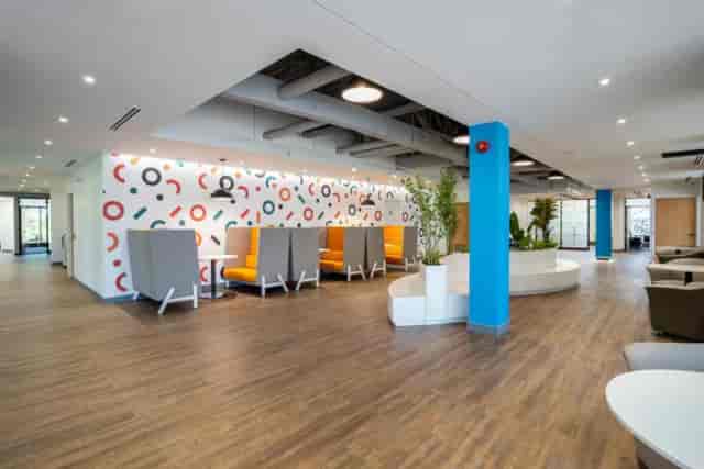 Modern S3PACE media room for conference breakout sessions and corporate networking.