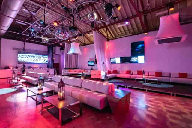 Industrial lounge event space with modular seating for corporate networking and brand activations.