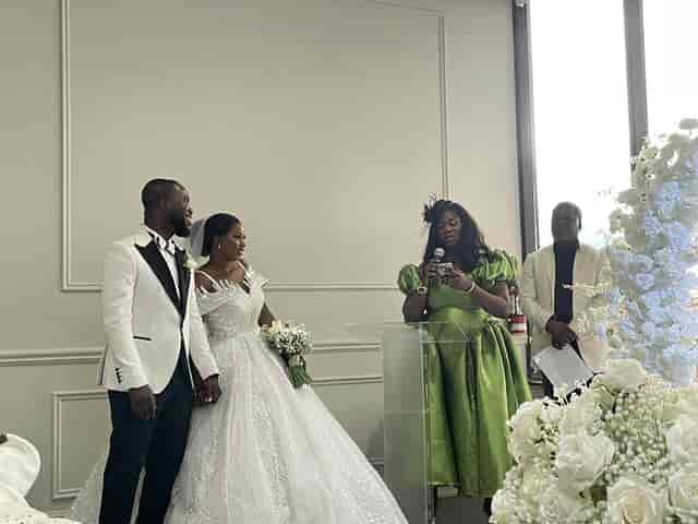 Modern wedding ceremony setup at Palacio Event Centre with floral centerpiece and acrylic lectern.