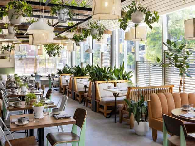 Stages Restaurant at Pantages: Biophilic event space for networking breakfast and breakout sessions.