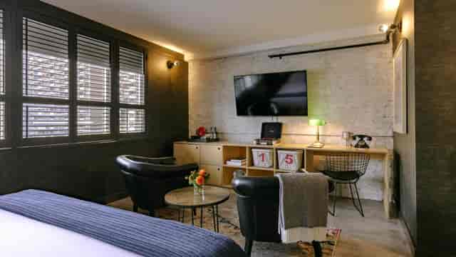 Boutique hotel suite with executive workspace for VIP business meetings and corporate events.