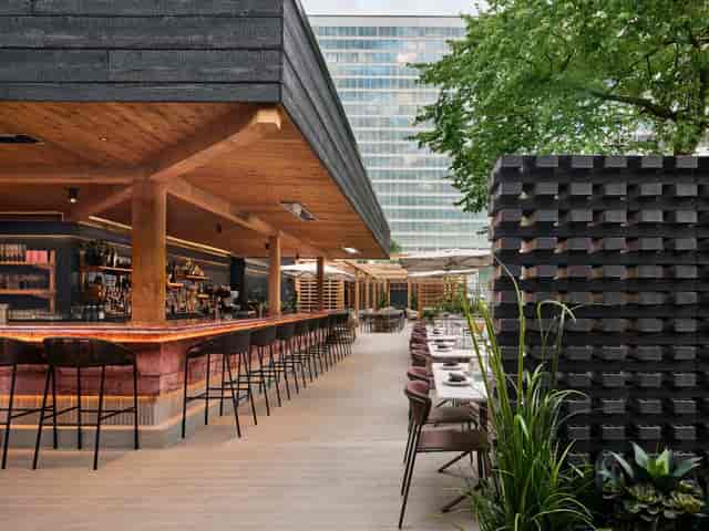 Outdoor terrace at The Quay with modern bar, perfect for corporate events and networking mixers.