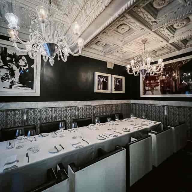 Private dining room at Harbour Sixty with crystal chandeliers for VIP corporate dinners.