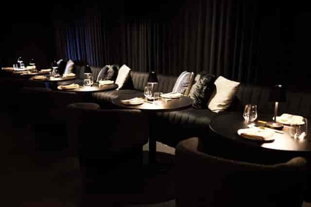 Ultra Restaurant lounge with plush banquette seating for VIP networking and executive dinners.
