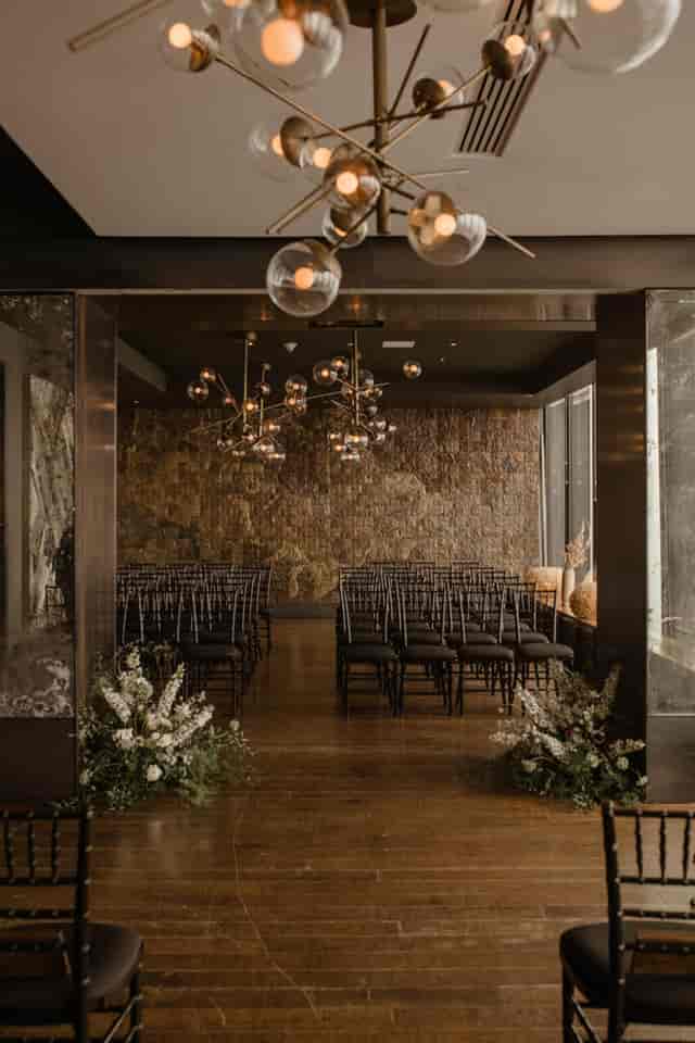 Luxury East Room event space with sculptural lighting for micro-weddings and executive meetings.