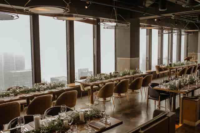 Modern event space at Canoe with floor-to-ceiling city views for corporate dinners or weddings.