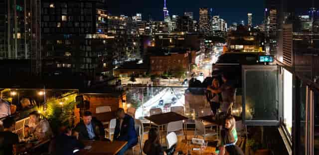 Rooftop bar with Toronto skyline view for corporate networking and cocktail events.