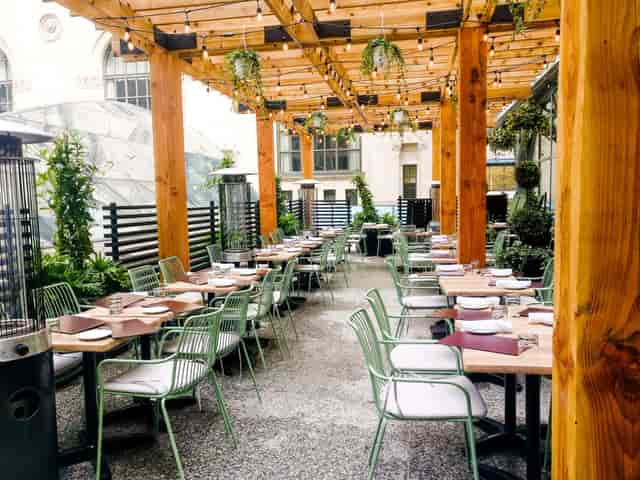 Outdoor terrace with string lighting for corporate happy hours and networking events.