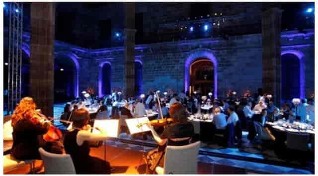 Gala dinner at La Llotja de Mar with historic architecture and classical music.