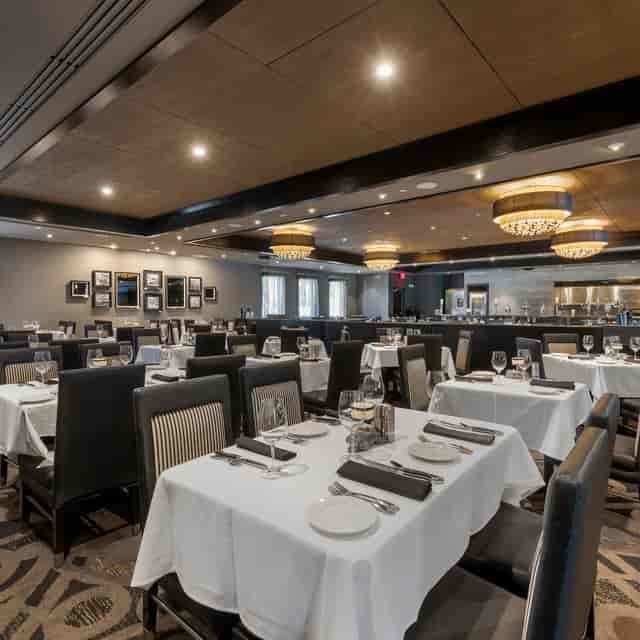 Upscale Morton's private dining room with refined table settings for corporate events and banquets.