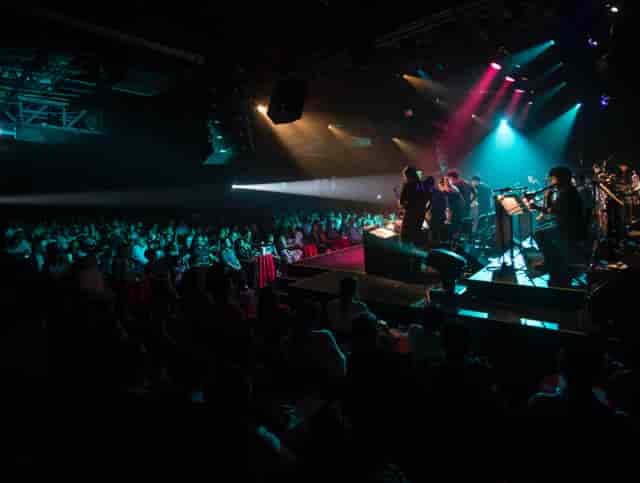 Live concert at Lunario del Auditorio Nacional with dramatic stage lighting and immersive production.