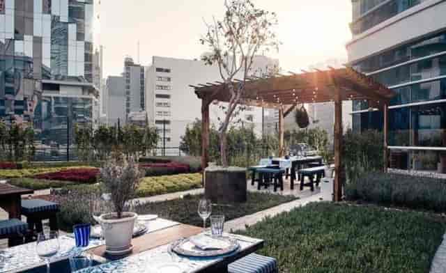 St. Regis rooftop secret garden for upscale corporate mixers and alfresco dinners.