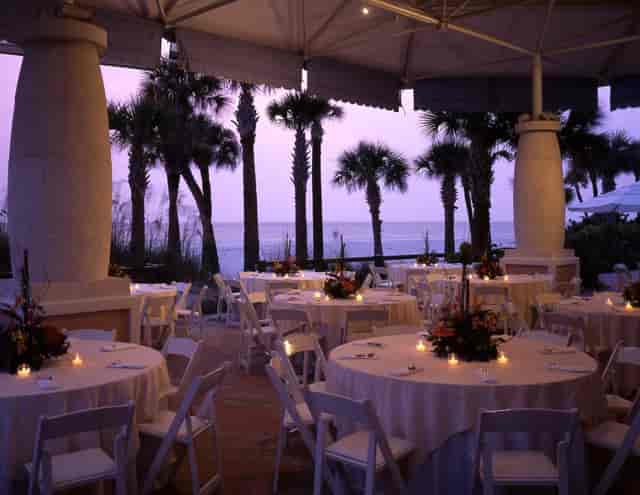 Upscale outdoor reception at The Don CeSar North/South Terrace with elegant sunset table settings.
