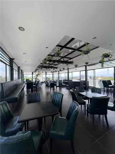 Modern Beirut rooftop terrace with floor-to-ceiling glass for corporate events and social mixers.