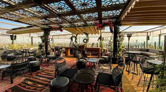 Geometric rooftop function room, perfect for high-end networking events and sunset receptions.