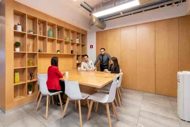 Modern wooden breakout space for professional meetings and focused collaborative coworking.