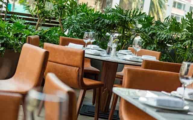 Upscale al fresco restaurant with leather seating for corporate luncheons and VIP events.