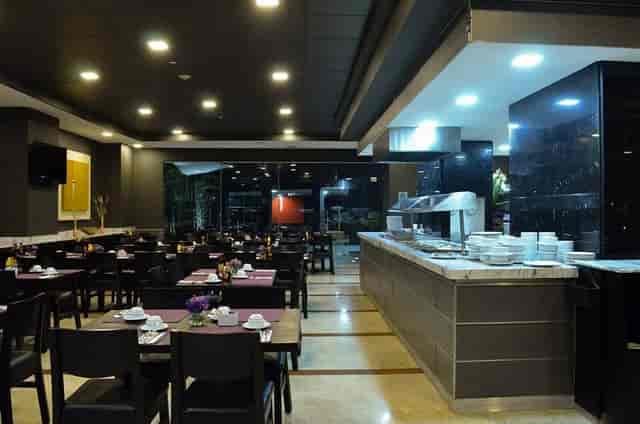 Modern hotel breakfast buffet dining area set for corporate catering events.