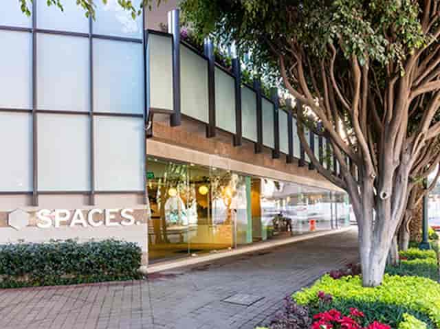 Modern glass-fronted coworking business center for professional pop-ups and networking events.
