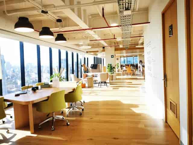 Modern coworking breakout space with lounge seating for professional networking and meetings.