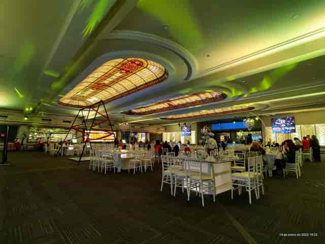 Palacio La Rochelle gala ballroom for graduation event with dramatic lighting and banquet seating.