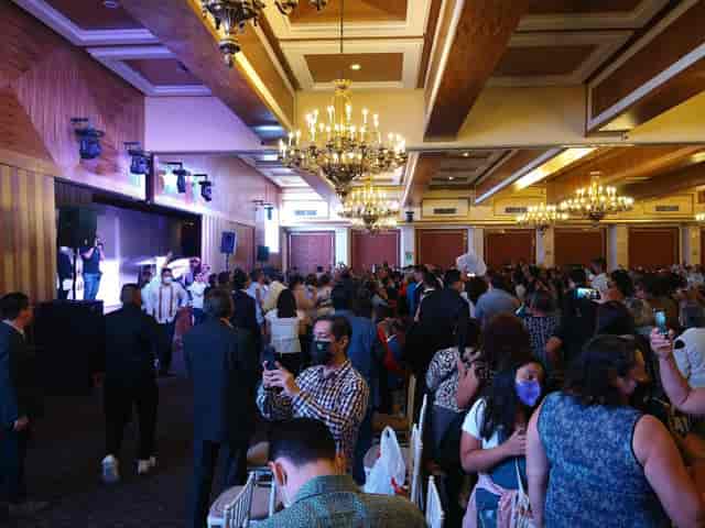 Ballroom event space with chandeliers for graduation ceremonies and social galas.