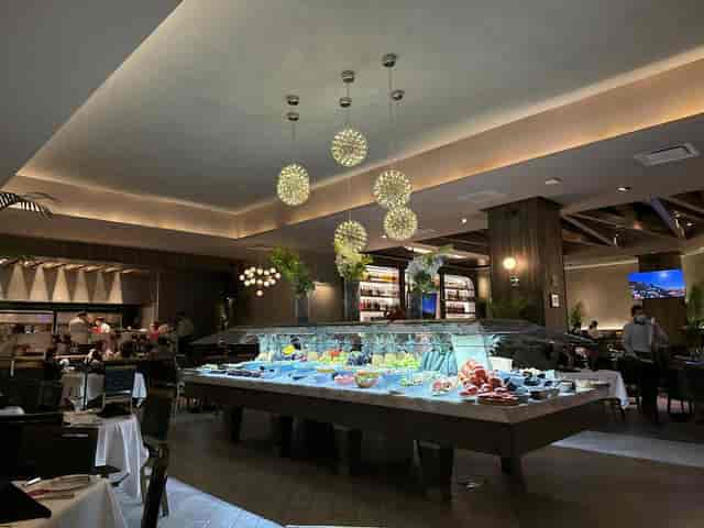 Fogo de Chão Perisur restaurant with illuminated buffet for private dining and networking events.