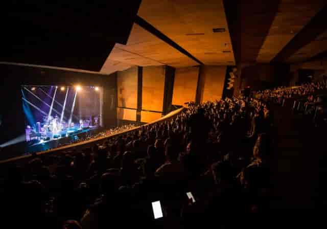 Auditorio BB theater stage with professional lighting for keynote and plenary events.