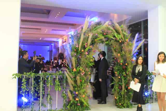 Floral archway in Club Alemán function room for luxury wedding or corporate event.