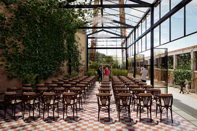 El Telar industrial venue with glass structure for boutique conferences and intimate ceremonies.